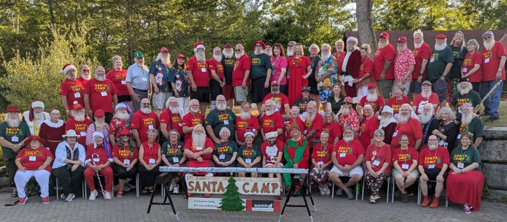 Group photo at Santa-themed camp event.