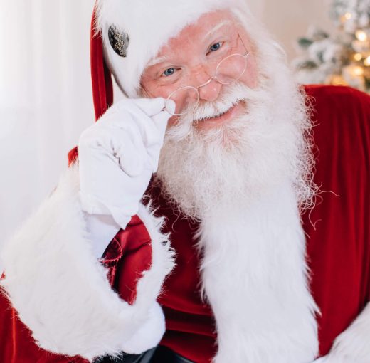 Close-up of Santa Claus smiling warmly.