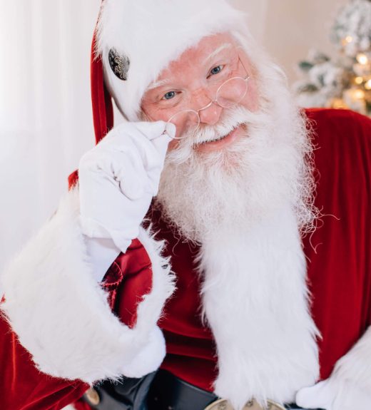 Close-up of Santa Claus smiling warmly.